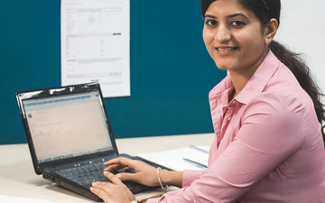 A female employee using a laptop computer