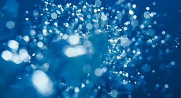 Air bubbles in blue coloured water.